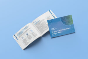 Communications Master Plan laid out on a table 