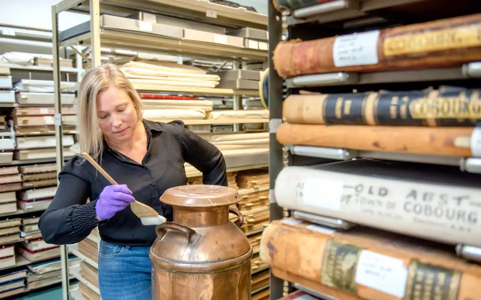 NCAM staff cleans artefact