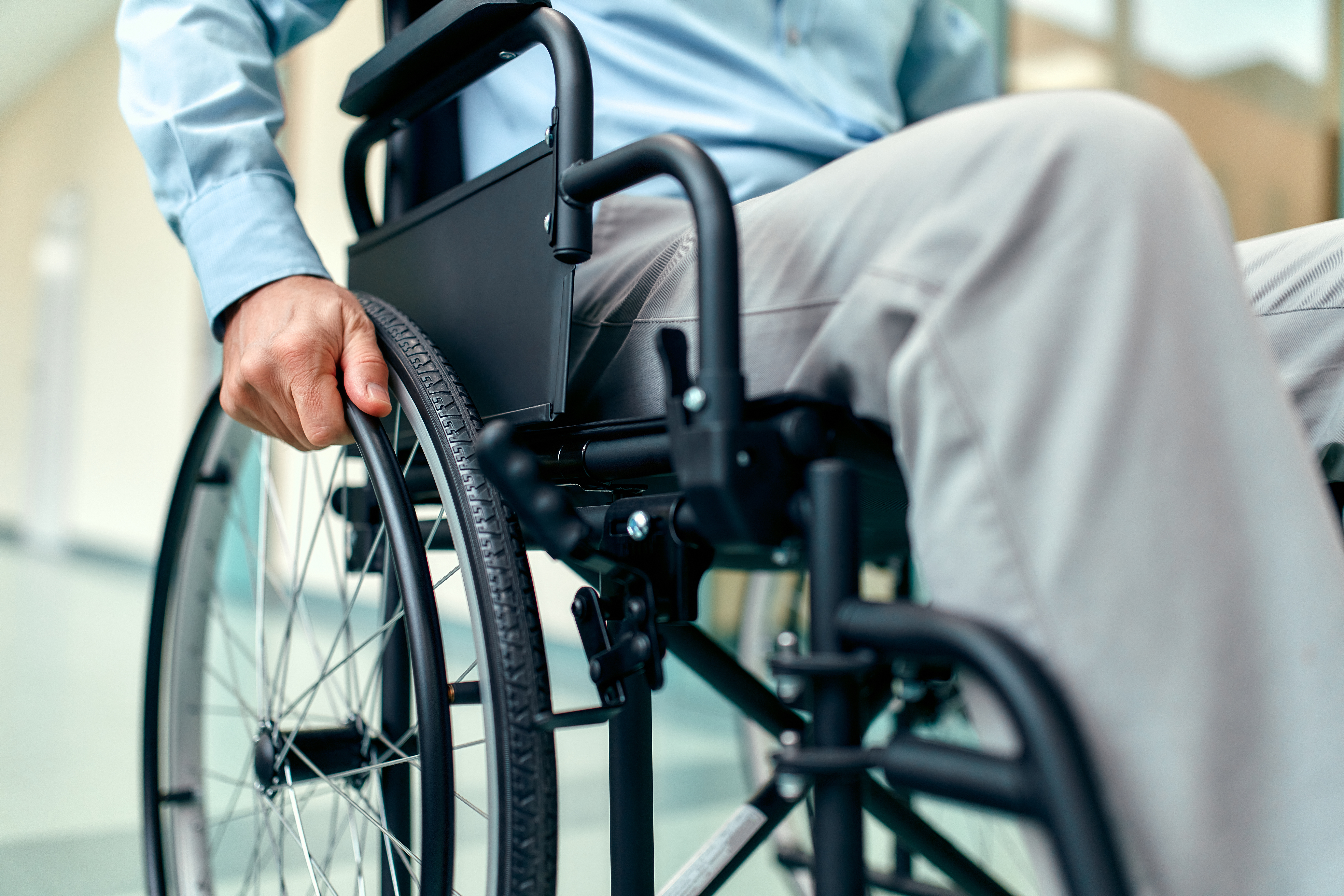 Close up of hand on a wheelchair wheel
