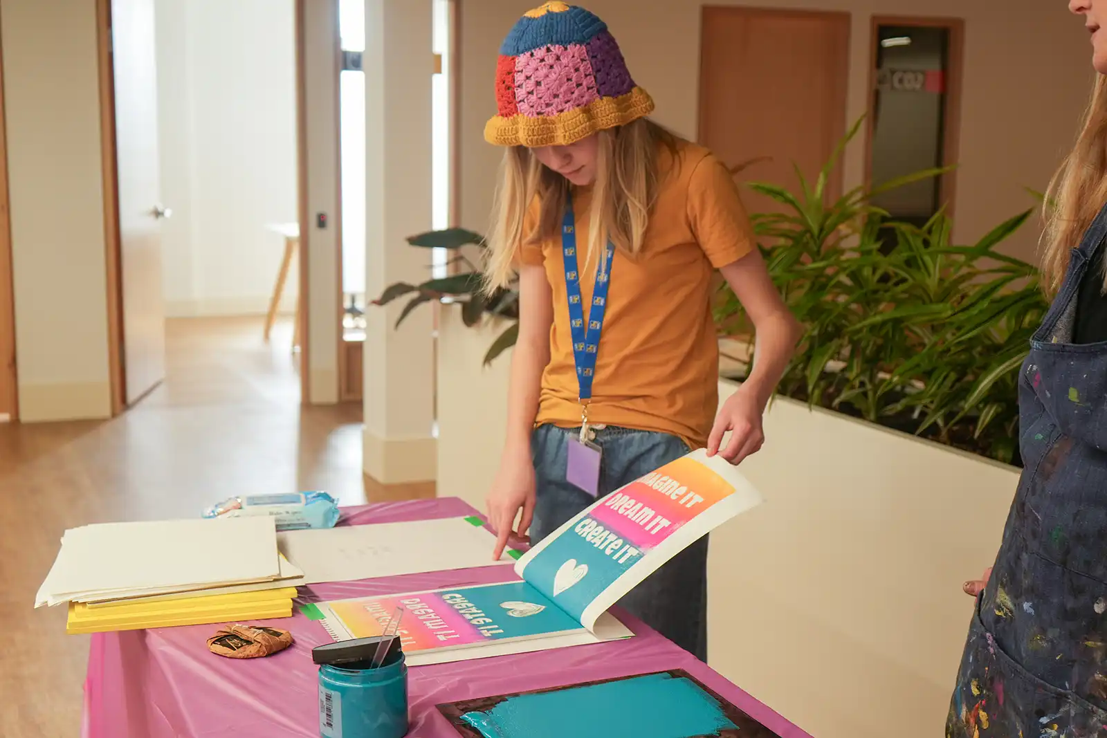 Participant working on a print during the printmaking workshop. 