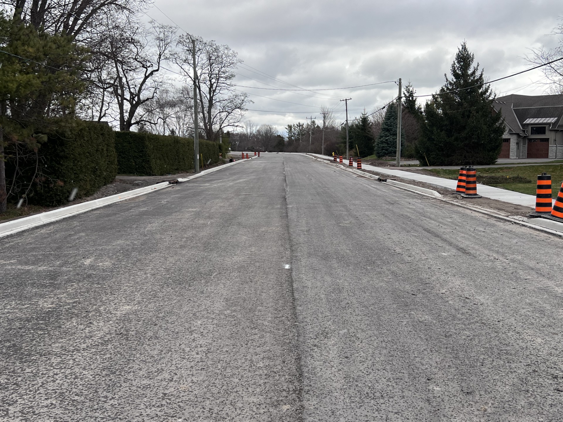 Photo of freshly paved County Road 64 in Brighton