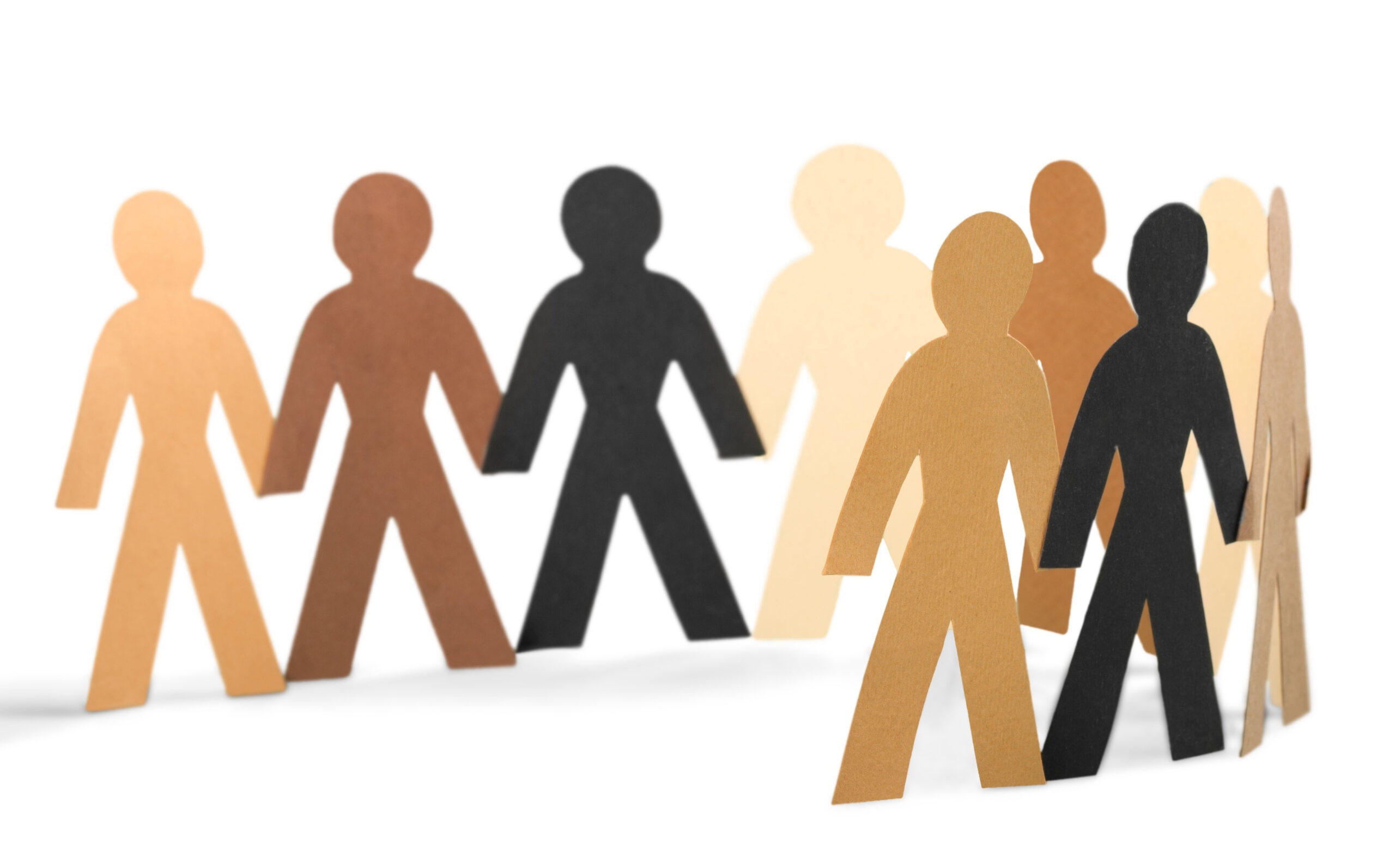 Paper cutouts of figures holding hands.