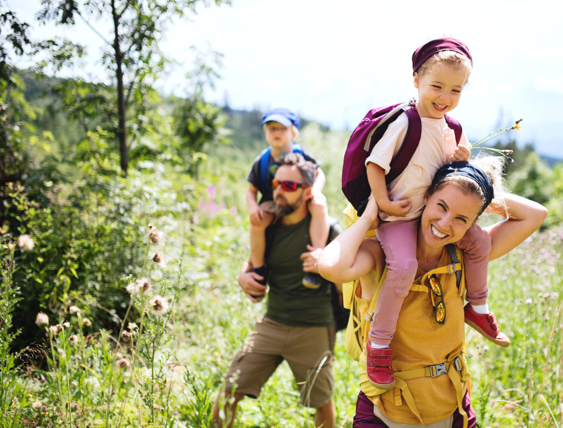 Family hiking in a wooded area.