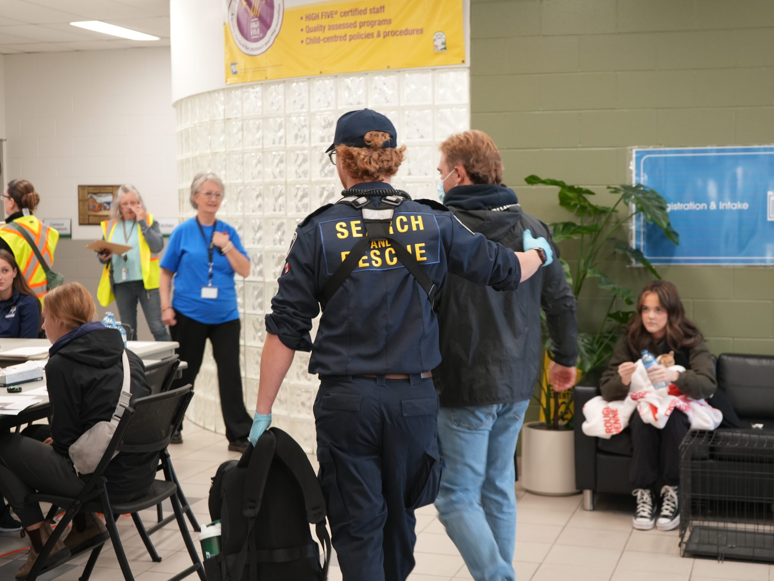 Search and rescue walks with someone through mock emergency exercise