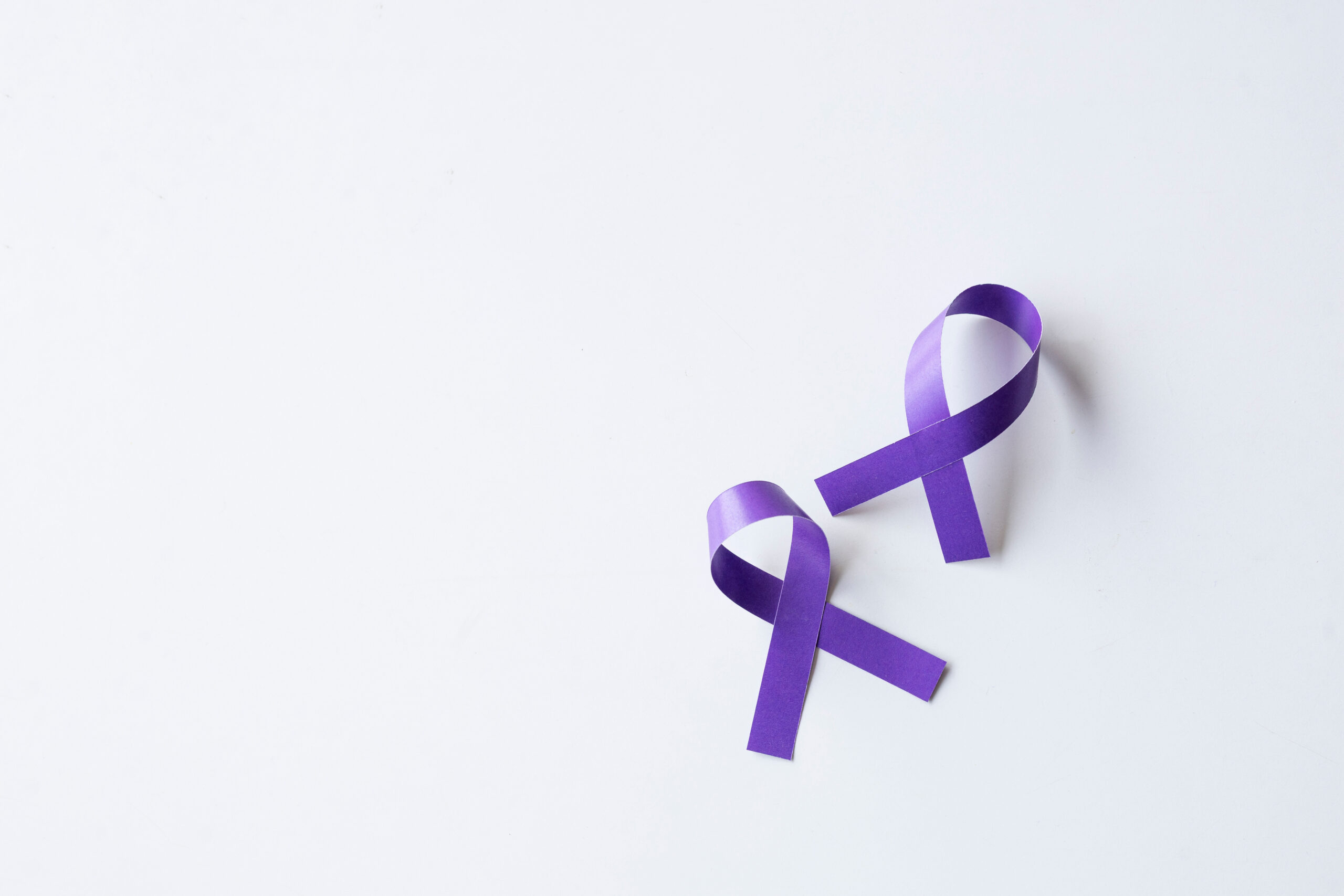 Purple awareness ribbons on a white background.
