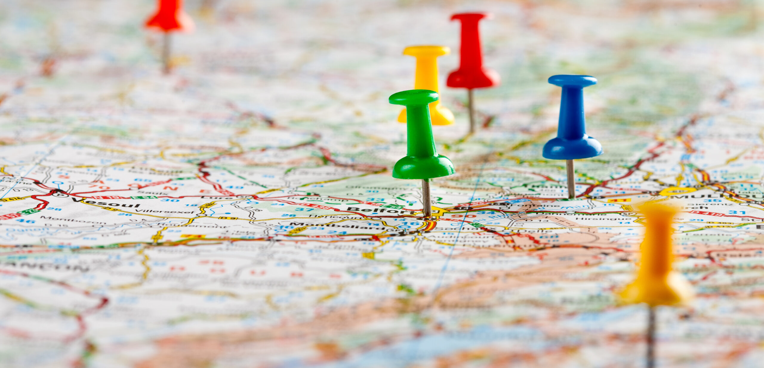 Pins on a paper map.