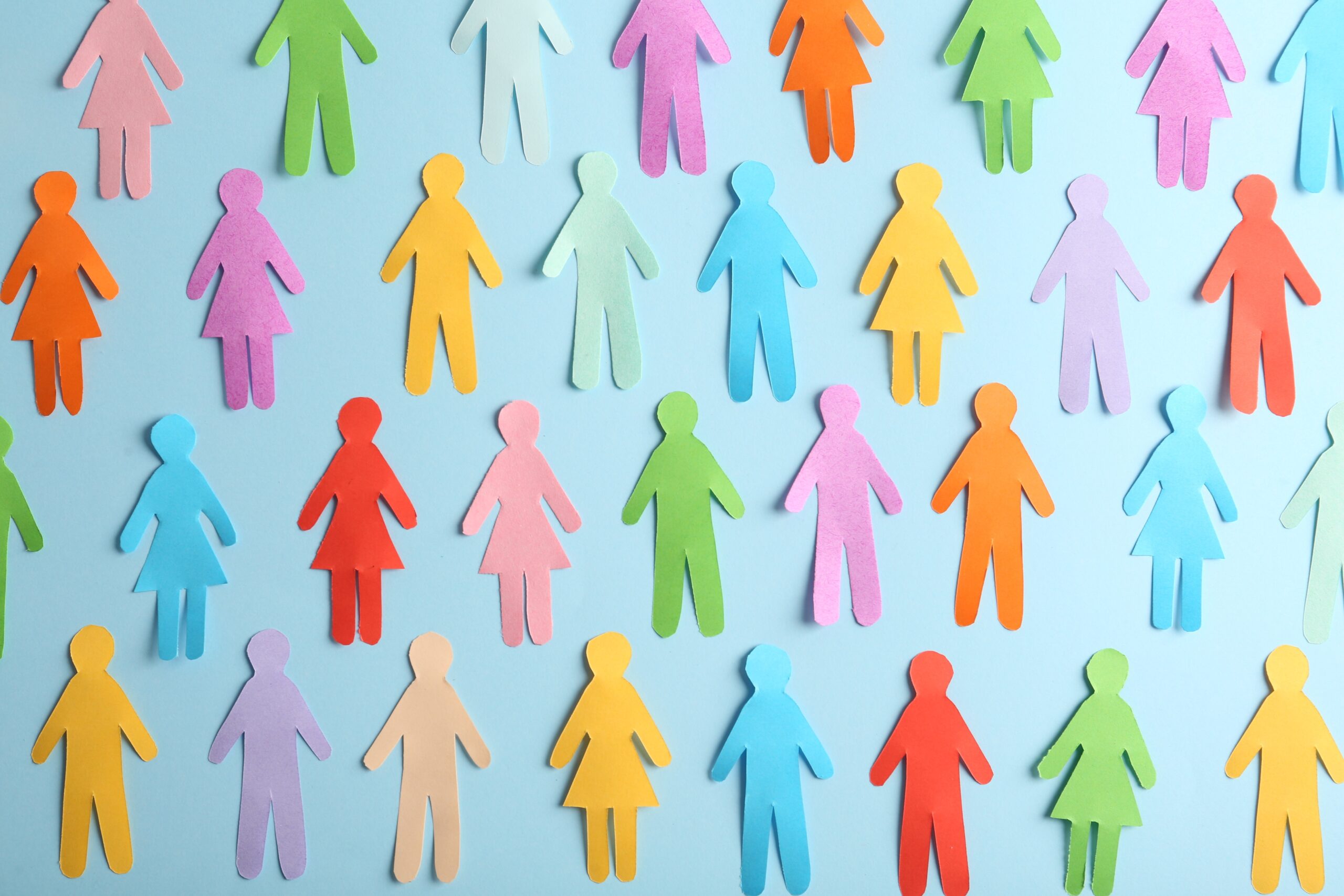 Colourful cutouts of figures on a blue backdrop.