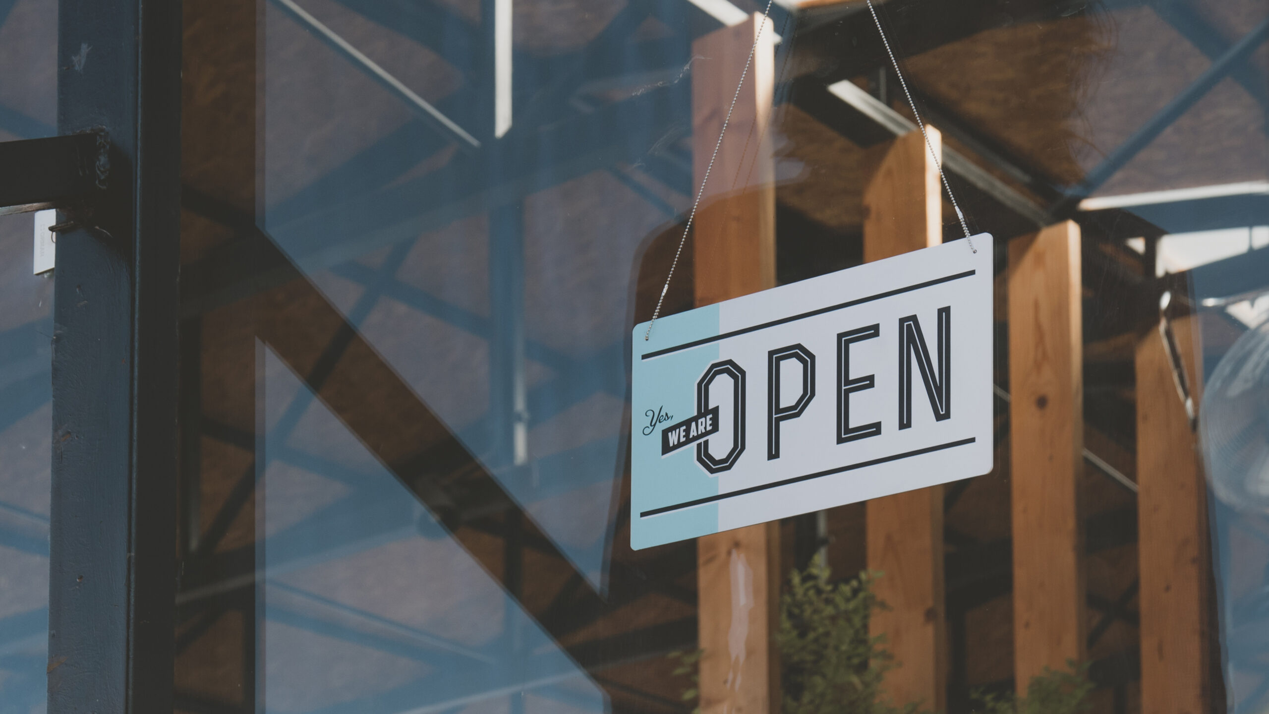 Open sign hanging in a window.