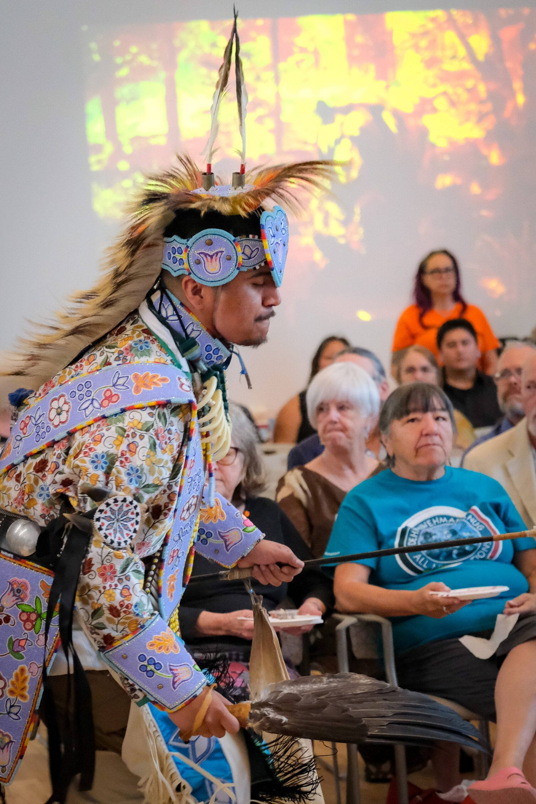 Indigenous drummer in traditional regalia